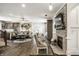 Beautiful open-concept living space with fireplace, hardwood floors, and cozy seating at 1037 Deer Lake Dr, Carmel, IN 46032