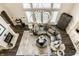 Aerial view of living room with fireplace and overhead chandelier at 1037 Deer Lake Dr, Carmel, IN 46032