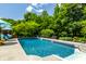 Beautiful pool with well-maintained landscaping, inviting lounge area, and ample space for outdoor activities and relaxation at 1037 Deer Lake Dr, Carmel, IN 46032