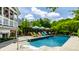 Gorgeous backyard featuring a sparkling pool, comfortable seating, and lush landscaping, creating a perfect outdoor retreat at 1037 Deer Lake Dr, Carmel, IN 46032