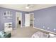 A serene bedroom offering ample space with a view into an en-suite bathroom at 10587 Proposal Pointe Way, Fishers, IN 46040