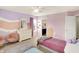 A bright bedroom featuring two beds and a view into an en-suite bathroom at 10587 Proposal Pointe Way, Fishers, IN 46040