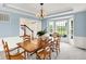 Bright dining room with a large bay window, wainscoting and a view of the stairs at 10587 Proposal Pointe Way, Fishers, IN 46040