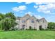 Beautiful two-story brick home with a manicured lawn and lush landscaping, perfect for curb appeal at 10587 Proposal Pointe Way, Fishers, IN 46040