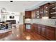 Open kitchen featuring hardwood floors, granite countertops, modern appliances, and open access to the dining and living areas at 10587 Proposal Pointe Way, Fishers, IN 46040
