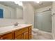 Bright bathroom with a vanity, a toilet, and a glass-enclosed shower at 1059 Wild Ivy Trl, Franklin, IN 46131