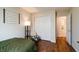 Neutral bedroom features a comfortable bed, closet, and access to the en-suite bathroom at 1059 Wild Ivy Trl, Franklin, IN 46131