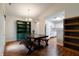 Bright dining area with wooden floors, stylish chandelier, and easy access to the kitchen at 1059 Wild Ivy Trl, Franklin, IN 46131