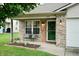 Welcoming front of this home with an inviting bench, a welcome sign, and charming lanterns at 1059 Wild Ivy Trl, Franklin, IN 46131