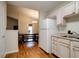 Open kitchen featuring laminate counters, white appliances, and plenty of storage space at 1059 Wild Ivy Trl, Franklin, IN 46131