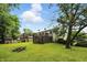 Backyard view showcasing a spacious lawn and large deck, perfect for outdoor entertaining at 1103 Rosengarten Dr, Greenwood, IN 46142