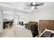 Spacious basement with brick fireplace, neutral carpet, ceiling fan and abundant room for customizable living space at 1103 Rosengarten Dr, Greenwood, IN 46142