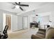 Open basement layout with multiple ceiling fans, adjacent rooms, offering versatility for various uses at 1103 Rosengarten Dr, Greenwood, IN 46142