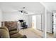 Finished basement featuring a brick accent wall, neutral carpet and versatile layout, perfect for a home office at 1103 Rosengarten Dr, Greenwood, IN 46142