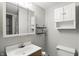 Bathroom with a white vanity, cabinet, decorative shelves, and a medicine cabinet mirror at 1103 Rosengarten Dr, Greenwood, IN 46142