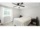 Cozy bedroom featuring a ceiling fan, a window with natural light, and neutral decor at 1103 Rosengarten Dr, Greenwood, IN 46142