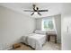 Small, light-filled bedroom with a ceiling fan and window views at 1103 Rosengarten Dr, Greenwood, IN 46142