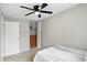 Well-lit bedroom with closet, ceiling fan, and neutral carpet at 1103 Rosengarten Dr, Greenwood, IN 46142