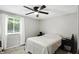 Bright bedroom with a ceiling fan, a window with natural light, and neutral decor at 1103 Rosengarten Dr, Greenwood, IN 46142