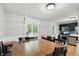 Open dining area with a wooden table, seating for six, and a view to the kitchen at 1103 Rosengarten Dr, Greenwood, IN 46142