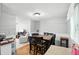 Open dining room features wood floors, table with chairs and natural light at 1103 Rosengarten Dr, Greenwood, IN 46142