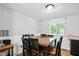 Bright dining room with a large wooden table, seating for six, and wainscoting accents at 1103 Rosengarten Dr, Greenwood, IN 46142