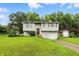 Charming two-story home with a well-maintained lawn and landscaping in a quiet neighborhood at 1103 Rosengarten Dr, Greenwood, IN 46142