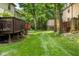 Spacious backyard with a lush green lawn and mature trees creating a private, serene outdoor space at 11529 Sunset Cove Ln # 11529, Indianapolis, IN 46236