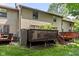 Exterior rear view of home featuring multiple decks in a shared backyard at 11529 Sunset Cove Ln # 11529, Indianapolis, IN 46236