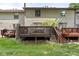 View of the decks on back of house with small grassy backyard at 11529 Sunset Cove Ln # 11529, Indianapolis, IN 46236
