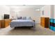Bedroom with a cozy bed, ample dresser storage and a small window at 11529 Sunset Cove Ln # 11529, Indianapolis, IN 46236