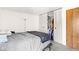 Neutral bedroom with sliding closet doors and warm, natural lighting at 11529 Sunset Cove Ln # 11529, Indianapolis, IN 46236
