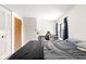 Relaxing bedroom with double closets, a large window, and a dedicated workspace at 11529 Sunset Cove Ln # 11529, Indianapolis, IN 46236