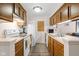 Functional kitchen with white appliances, ample cabinet space, and a hardwood floor at 11529 Sunset Cove Ln # 11529, Indianapolis, IN 46236
