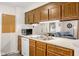Functional kitchen with a pass-through view into the living room area at 11529 Sunset Cove Ln # 11529, Indianapolis, IN 46236