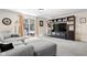 Cozy living room with plush gray carpeting and a sliding glass door leading to an outdoor patio at 11529 Sunset Cove Ln # 11529, Indianapolis, IN 46236