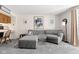 Cozy living room featuring plush carpeting, comfortable seating, and an open layout to the bar area at 11529 Sunset Cove Ln # 11529, Indianapolis, IN 46236