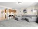 Spacious living room featuring plush carpeting, comfortable seating, and lots of natural light at 11529 Sunset Cove Ln # 11529, Indianapolis, IN 46236