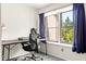 Comfortable home office setup bathed in natural light from the window view at 11529 Sunset Cove Ln # 11529, Indianapolis, IN 46236