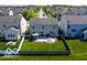 Aerial view of a home with a well-maintained lawn and patio area in the backyard at 12584 Cold Stream Rd, Noblesville, IN 46060