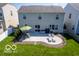 Spacious backyard featuring a patio area with an umbrella and two lounge chairs at 12584 Cold Stream Rd, Noblesville, IN 46060