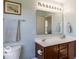 Bathroom featuring a double sink vanity with cabinets and a large mirror at 12584 Cold Stream Rd, Noblesville, IN 46060
