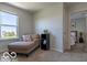 Bedroom with a comfy chaise lounge, bookshelf, and bright window at 12584 Cold Stream Rd, Noblesville, IN 46060