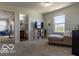 Bedroom with chaise lounge, window, and access to bath at 12584 Cold Stream Rd, Noblesville, IN 46060