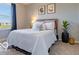 Cozy bedroom with a plush bed, neutral decor, and natural light from the window at 12584 Cold Stream Rd, Noblesville, IN 46060