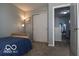 Bedroom with closet doors and view of hallway at 12584 Cold Stream Rd, Noblesville, IN 46060