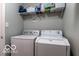 Functional laundry room featuring a washer, dryer, and wire shelving for storage at 12584 Cold Stream Rd, Noblesville, IN 46060