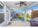 Cozy back porch with ceiling fan, outdoor lighting, and entertainment area, perfect for relaxation at 12634 Mustard Seed Ct, Fishers, IN 46038