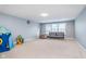 Expansive basement offering versatile space for recreation and relaxation; includes neutral carpet and good lighting at 12634 Mustard Seed Ct, Fishers, IN 46038