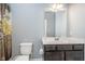 Bathroom with a modern dark wood vanity, white countertop, and decorative shower curtain at 12634 Mustard Seed Ct, Fishers, IN 46038